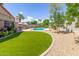 Landscaped backyard with a pool and artificial turf at 18877 N 59Th Dr, Glendale, AZ 85308