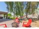 Backyard with firepit, red chairs, and a hammock at 18877 N 59Th Dr, Glendale, AZ 85308