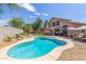 Stunning kidney-shaped pool with expansive backyard and patio area at 18877 N 59Th Dr, Glendale, AZ 85308