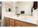 Clean bathroom with double vanity and a large mirror at 18877 N 59Th Dr, Glendale, AZ 85308