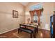 Formal dining room with wood floors and a built in bench at 18877 N 59Th Dr, Glendale, AZ 85308