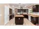 Kitchen with dark cabinets, stainless steel appliances and an island at 18877 N 59Th Dr, Glendale, AZ 85308