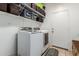 Laundry room with washer, dryer, and shelving at 18877 N 59Th Dr, Glendale, AZ 85308