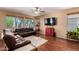 Living room with hardwood floors and a view of the backyard at 18877 N 59Th Dr, Glendale, AZ 85308