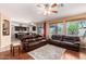 Open living room with hardwood floors and a view of the kitchen at 18877 N 59Th Dr, Glendale, AZ 85308