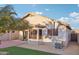 Home's backyard features a patio and grassy area at 20947 N 107Th Dr, Peoria, AZ 85373