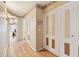 Light hardwood floors and neutral-toned walls in hallway at 20947 N 107Th Dr, Peoria, AZ 85373