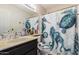 Bathroom featuring a vanity, mirror, and turtle themed shower curtain at 21063 N 33Rd Ln, Phoenix, AZ 85027