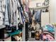 Walk-in closet with clothes rack and various containers at 21063 N 33Rd Ln, Phoenix, AZ 85027