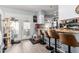 Kitchen area featuring tiled floors, bar seating, and direct access to the exterior at 21063 N 33Rd Ln, Phoenix, AZ 85027