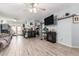 Open-concept living room with tile floors, seamlessly connecting to the kitchen area at 21063 N 33Rd Ln, Phoenix, AZ 85027