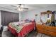 Main bedroom featuring a ceiling fan, wood floors, and ample space at 21063 N 33Rd Ln, Phoenix, AZ 85027