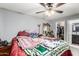 Main bedroom featuring ceiling fan, closet access, and dresser at 21063 N 33Rd Ln, Phoenix, AZ 85027