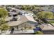 Aerial view of home's backyard, showing the house and neighboring properties at 2115 W Harwell Rd, Phoenix, AZ 85041