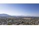 Aerial view of houses and community, landscape, and mountain background at 2115 W Harwell Rd, Phoenix, AZ 85041