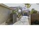 Landscaped backyard with a wooden gate and detached garage at 2115 W Harwell Rd, Phoenix, AZ 85041