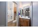 Small bathroom with shower/tub combo and wood vanity at 2115 W Harwell Rd, Phoenix, AZ 85041