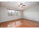 Bright bedroom with hardwood floors and large windows at 2115 W Harwell Rd, Phoenix, AZ 85041