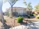 Single-story home with desert landscaping and a two-car garage at 2115 W Harwell Rd, Phoenix, AZ 85041