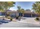 Single-story home with a two-car garage and well-manicured landscaping at 2115 W Harwell Rd, Phoenix, AZ 85041