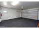 Large garage with an overhead door and epoxy floor at 2115 W Harwell Rd, Phoenix, AZ 85041