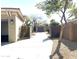 Private driveway leading to a detached garage and backyard at 2115 W Harwell Rd, Phoenix, AZ 85041