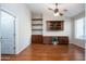 Home office with wood built-ins and hardwood floors at 2115 W Harwell Rd, Phoenix, AZ 85041