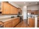 Kitchen with granite countertops, wood cabinets, and stainless steel appliances at 2115 W Harwell Rd, Phoenix, AZ 85041