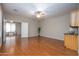 Living room with hardwood floors and access to kitchen at 2115 W Harwell Rd, Phoenix, AZ 85041