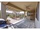 Covered patio with brick flooring and ceiling fan at 2115 W Harwell Rd, Phoenix, AZ 85041