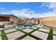 Stunning backyard with a pool, spa, and outdoor kitchen; perfect for entertaining at 21632 W Hillcrest Blvd, Buckeye, AZ 85396