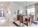 Bright dining room features a large wooden table and chandelier at 21632 W Hillcrest Blvd, Buckeye, AZ 85396