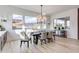 Sunlit dining room with a large table and mountain views at 21632 W Hillcrest Blvd, Buckeye, AZ 85396