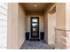 Covered entryway with modern door and tile flooring at 21632 W Hillcrest Blvd, Buckeye, AZ 85396