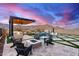 Relaxing firepit area with mountain views; perfect for cool evenings at 21632 W Hillcrest Blvd, Buckeye, AZ 85396