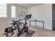 Home gym featuring Peloton bike and road bike at 21632 W Hillcrest Blvd, Buckeye, AZ 85396