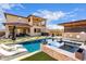 Luxury pool and spa with mountain views; resort-style backyard at 21632 W Hillcrest Blvd, Buckeye, AZ 85396