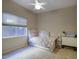 Small bedroom with twin-size bed and window seat at 23861 N 74Th Pl, Scottsdale, AZ 85255