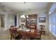 Bright dining room with hardwood table and chairs, and a built-in hutch at 23861 N 74Th Pl, Scottsdale, AZ 85255