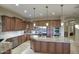 Gourmet kitchen with granite countertops, custom cabinetry, and stainless steel appliances at 23861 N 74Th Pl, Scottsdale, AZ 85255