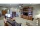 Relaxing living room featuring built-in wooden shelving and comfortable seating at 23861 N 74Th Pl, Scottsdale, AZ 85255