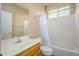 Bathroom with single vanity, bathtub, and window at 23901 S Vacation Way, Sun Lakes, AZ 85248