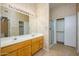 Double vanity bathroom with shower and linen closet at 23901 S Vacation Way, Sun Lakes, AZ 85248