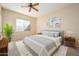 Cozy bedroom with a queen-size bed and ample natural light at 23901 S Vacation Way, Sun Lakes, AZ 85248