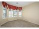 Bright bedroom with window seat and plantation shutters at 23901 S Vacation Way, Sun Lakes, AZ 85248