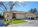 Single-story home with two-car garage and landscaped lawn at 23901 S Vacation Way, Sun Lakes, AZ 85248