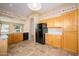 Bright kitchen featuring wood cabinets and black appliances at 23901 S Vacation Way, Sun Lakes, AZ 85248