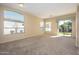 Spacious living room with carpeting and sliding glass doors at 23901 S Vacation Way, Sun Lakes, AZ 85248