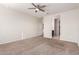 Bright bedroom with ceiling fan and en-suite bathroom access at 2455 E Alida Trl, Casa Grande, AZ 85194