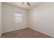 Bright bedroom with ceiling fan and carpet flooring at 2455 E Alida Trl, Casa Grande, AZ 85194